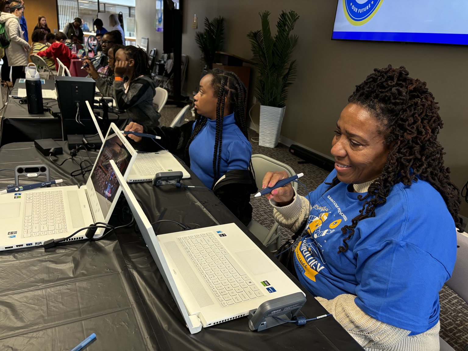Donna Jones participating in a student technology activity